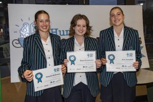 3 girls showing their certificates